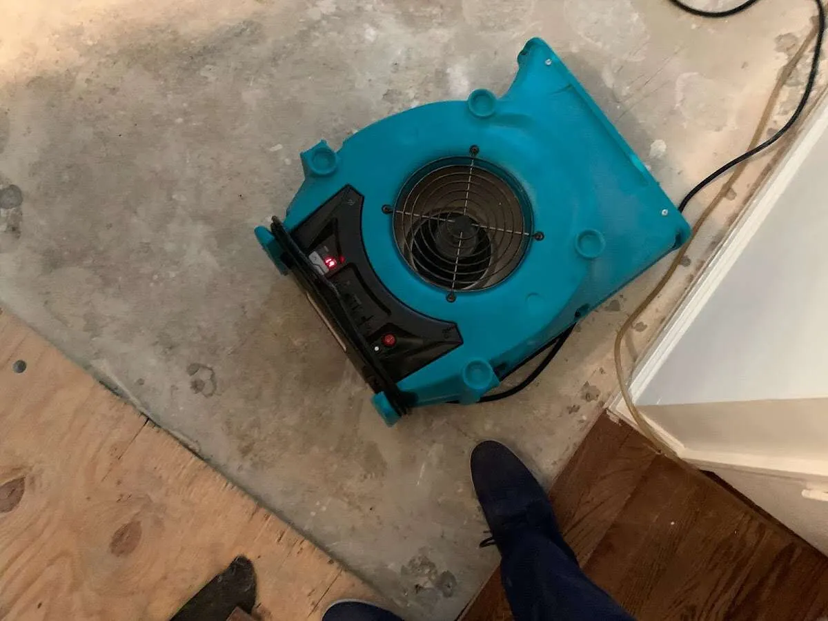 Air mover drying subfloor during Leak Detection & Repair in El Rio